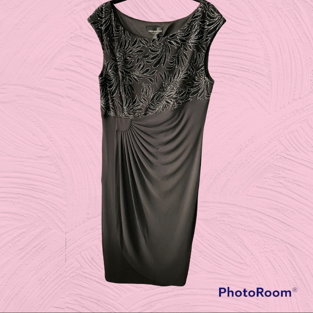 New dress in black with silver accents.